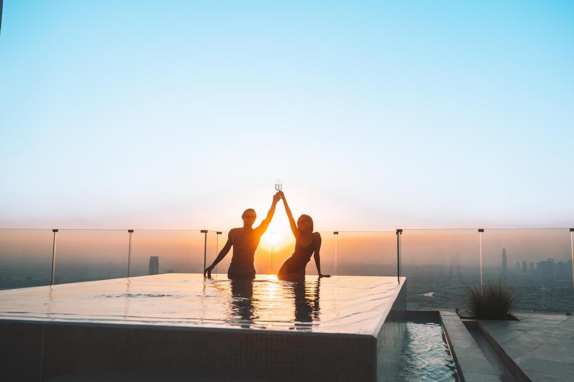 Five Jumeirah Village Dubai Exterior photo Sunset at the rooftop pool
