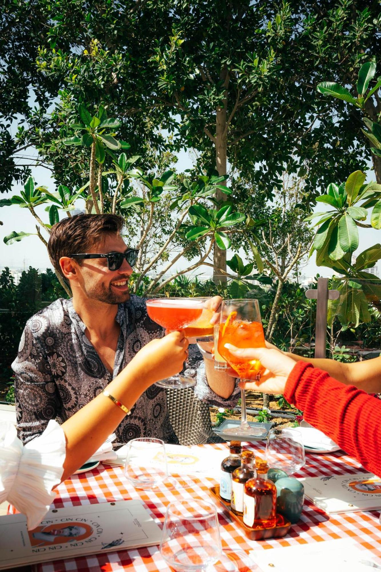 Five Jumeirah Village Dubai Exterior photo A man drinking a spritz